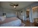 Spacious main bedroom features hardwood floors, walk-out to balcony and large windows at 712 Cordova Greens # 712, Largo, FL 33777
