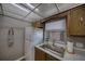 View of the well lit, compact kitchen area with marble countertops and sleek white appliances providing an efficient workspace at 712 Cordova Greens # 712, Largo, FL 33777