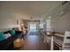 Inviting living room featuring wood floors and neutral walls, creating a comfortable and welcoming atmosphere at 712 Cordova Greens # 712, Largo, FL 33777