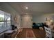 Bright living room with wood floors and sliding glass doors, seamlessly blending indoor and outdoor living spaces at 712 Cordova Greens # 712, Largo, FL 33777