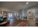 Open-concept living and dining area boasts wood floors and sliding doors opening to a tranquil outdoor space at 712 Cordova Greens # 712, Largo, FL 33777
