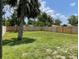 Spacious backyard features a well-kept lawn and new wooden privacy fence at 7635 N 55Th N St, Pinellas Park, FL 33781