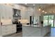 Modern kitchen featuring white cabinets, stainless steel appliances, and a large center island at 7635 N 55Th N St, Pinellas Park, FL 33781