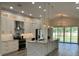 Bright kitchen featuring white cabinets, stainless appliances, and a large island at 7635 N 55Th N St, Pinellas Park, FL 33781