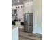 Modern kitchen featuring white cabinets, stainless steel appliances, and a large center island at 7635 N 55Th N St, Pinellas Park, FL 33781