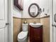 Bathroom with a sink, toilet, and tile walls at 811 Woodley Rd, Clearwater, FL 33764