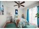 Comfortable bedroom featuring blue accents, ceiling fan and a serene, inviting atmosphere at 811 Woodley Rd, Clearwater, FL 33764