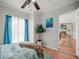 Bedroom with a pool view, tiled flooring, and blue accents at 811 Woodley Rd, Clearwater, FL 33764