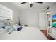 Comfortable bedroom with plush pillows and a ceiling fan at 811 Woodley Rd, Clearwater, FL 33764