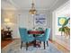 Charming dining room with a chandelier, complemented by hardwood floors and neutral wall paint at 811 Woodley Rd, Clearwater, FL 33764