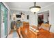 Dining room and living room, features a fireplace, fan, and an open layout at 811 Woodley Rd, Clearwater, FL 33764