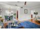 Hardwood floors connect the living room with a dining area, enhancing the open flow of the home at 811 Woodley Rd, Clearwater, FL 33764
