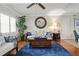 Comfortable living room area featuring hardwood floors, stylish furnishings, and bright lighting at 811 Woodley Rd, Clearwater, FL 33764