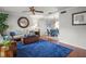 Bright living room with hardwood floors flowing into an adjacent dining area, ideal for entertaining at 811 Woodley Rd, Clearwater, FL 33764