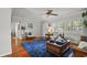 Inviting living room area featuring hardwood floors, plantation shutters, and neutral wall paint at 811 Woodley Rd, Clearwater, FL 33764