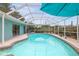 The pool has a screened enclosure which allows for seamless indoor-outdoor lifestyle at 811 Woodley Rd, Clearwater, FL 33764