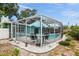 The property features a beautiful pool with screened in patio, perfect for relaxing outside at 811 Woodley Rd, Clearwater, FL 33764