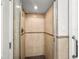 Shower with tile surround and glass doors at 811 Woodley Rd, Clearwater, FL 33764