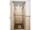 Bathroom shower with tile surround and glass doors at 811 Woodley Rd, Clearwater, FL 33764