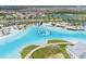 Breathtaking aerial view of the lagoon amenities and residential area at 8891 Bower Bass Cir, Wesley Chapel, FL 33545