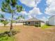 Backyard featuring a lawn, a soccer goal, and a house at 8891 Bower Bass Cir, Wesley Chapel, FL 33545