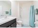 Bathroom featuring a shower with curtain, a toilet, and a vanity with dark cabinets at 8891 Bower Bass Cir, Wesley Chapel, FL 33545