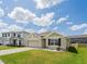 Charming single-Gathering home with a well-manicured lawn and inviting curb appeal at 8891 Bower Bass Cir, Wesley Chapel, FL 33545