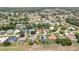 Aerial shot showcasing a home with neatly manicured lawn within a residential neighborhood, highlighted in red at 9346 Southern Belle Dr, Weeki Wachee, FL 34613