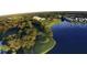 Overhead view of a picturesque golf course near a serene lake, blending nature with recreational amenities at 9346 Southern Belle Dr, Weeki Wachee, FL 34613