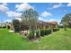 Spacious backyard featuring lush green grass and a screened-in pool area, great for outdoor enjoyment at 9346 Southern Belle Dr, Weeki Wachee, FL 34613