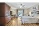 Bright bedroom with sliding glass doors to a patio, wood-look floors, and ceiling fan at 9346 Southern Belle Dr, Weeki Wachee, FL 34613