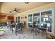 Outdoor patio with ceiling fan and sliding glass doors to the pool at 9346 Southern Belle Dr, Weeki Wachee, FL 34613