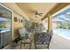 Comfortable covered patio with seating and a view of the pool at 9346 Southern Belle Dr, Weeki Wachee, FL 34613