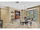 Dining area with table, four chairs, a bay window and a china hutch at 9346 Southern Belle Dr, Weeki Wachee, FL 34613
