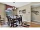 Elegant dining room featuring a decorative chandelier and views of the outdoors at 9346 Southern Belle Dr, Weeki Wachee, FL 34613