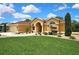 Charming single-story home featuring a well-manicured lawn and inviting curb appeal at 9346 Southern Belle Dr, Weeki Wachee, FL 34613