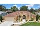 Beautiful single-story home featuring lush landscaping and a welcoming entrance at 9346 Southern Belle Dr, Weeki Wachee, FL 34613