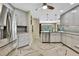 Bright kitchen with stainless steel appliances, granite counters, and stylish tile flooring at 9346 Southern Belle Dr, Weeki Wachee, FL 34613