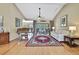 Spacious living room featuring high ceilings, hardwood floors, and natural light at 9346 Southern Belle Dr, Weeki Wachee, FL 34613
