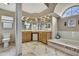 Large bathroom with soaking tub, dual vanity and ample natural light at 9346 Southern Belle Dr, Weeki Wachee, FL 34613