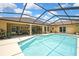 Lovely screened-in pool area with ample space for lounging and enjoying the Florida sunshine at 9346 Southern Belle Dr, Weeki Wachee, FL 34613