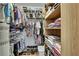 Spacious walk-in closet with ample shelving and clothing racks for organized storage at 9346 Southern Belle Dr, Weeki Wachee, FL 34613