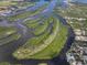 Aerial view featuring waterways, islands, and waterfront homes, offering a picturesque view at 100 18Th Nw St, Ruskin, FL 33570