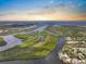 Stunning aerial view of winding waterways, lush greenery, and the home's coastal community at 100 18Th Nw St, Ruskin, FL 33570