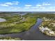 Expansive aerial view of a stunning waterfront community and lush greenery at 100 18Th Nw St, Ruskin, FL 33570