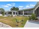 Backyard with a lawn, waterfront access and landscaping at 100 18Th Nw St, Ruskin, FL 33570