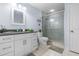 Cozy bathroom featuring a vanity with sink and a glass door shower, exuding a peaceful ambiance at 100 18Th Nw St, Ruskin, FL 33570