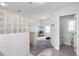 Bright bathroom featuring a glass block shower, soaking tub, and a separate toilet room at 100 18Th Nw St, Ruskin, FL 33570