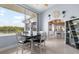 Cozy dining area with water views and a glimpse into the open kitchen layout at 100 18Th Nw St, Ruskin, FL 33570