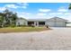 Charming one story home featuring a spacious lot and two car garage at 100 18Th Nw St, Ruskin, FL 33570